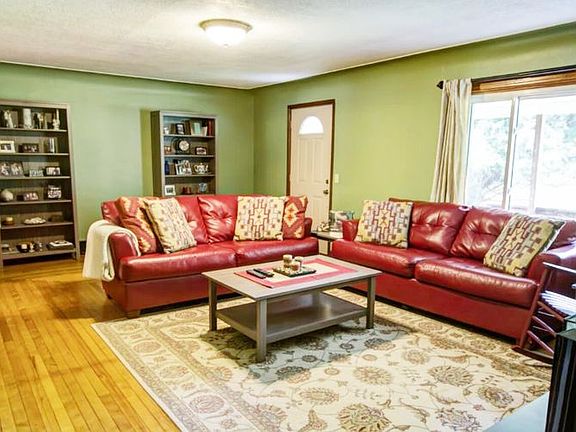 This exceptional living room has hardwood floors and cove ceilings.