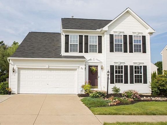 The extended driveway provides room for three cars.