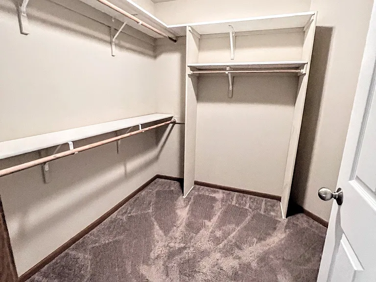 Primary Bedroom walk-in closet