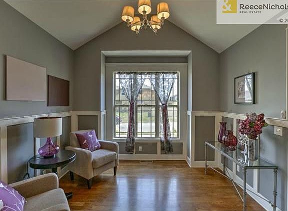 Custom wall rails highlight the front room..office? sitting room