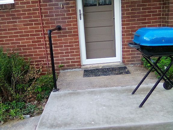 Side door off kitchen with new concrete slab