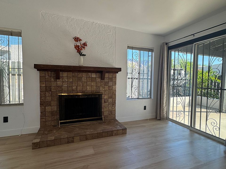 living room with wood burning fireplace