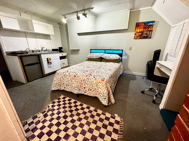 Bedroom 4: Basement bedroom with kitchenette. Private entrance and private yard.