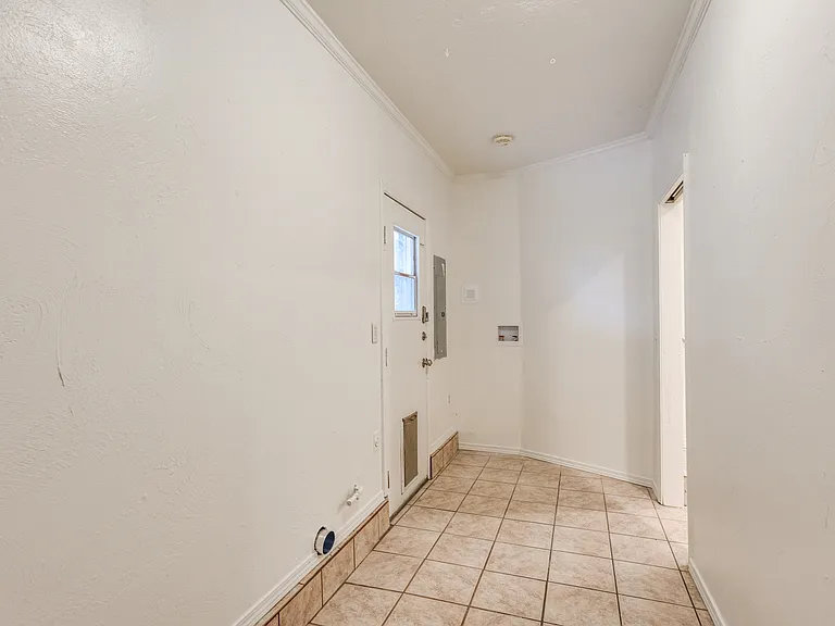 laundry with backyard access