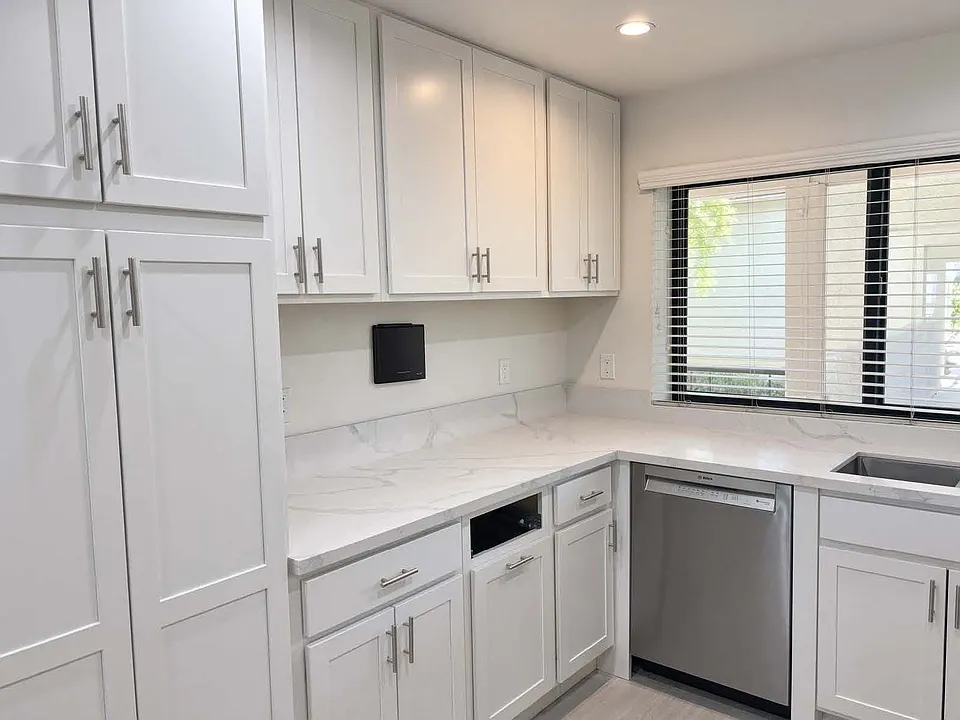 Left side of kitchen.