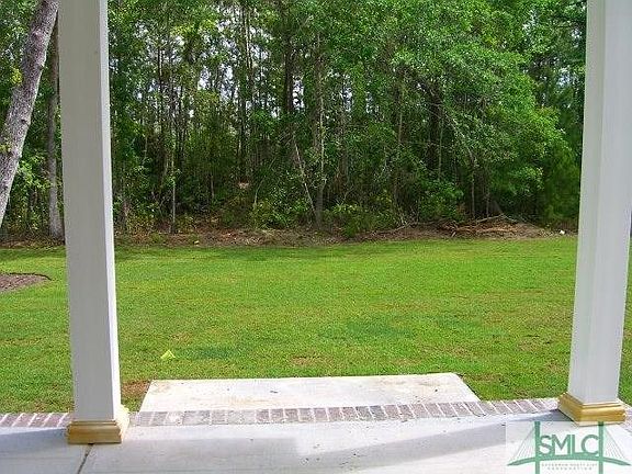 WOODED VIEW FROM COVERED BACK PORCH
