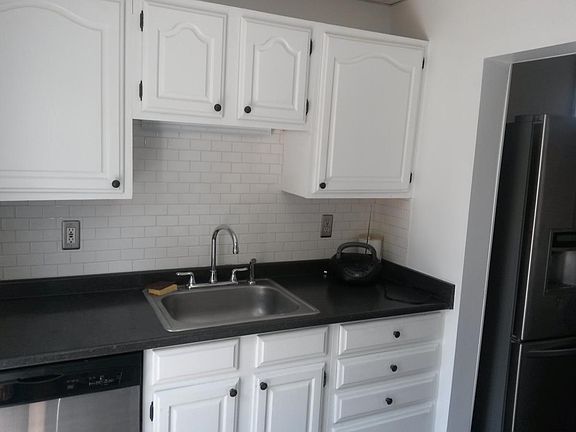 bright kitchen with stainless steel appliances
