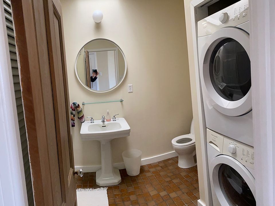 Skylit bathroom with full size washer and dryer