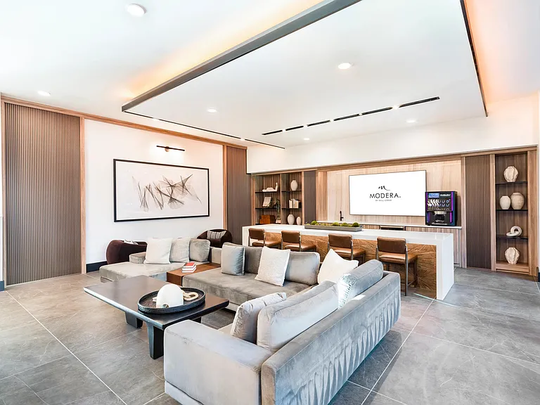 Sleek and inviting, this lounge offers plush seating, a large TV, and a self-serve beverage bar perfect for casual hangs or catching the game.