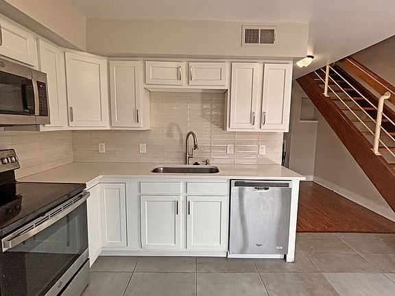 All stainless appliances including dishwasher, fridge, stove and microwave