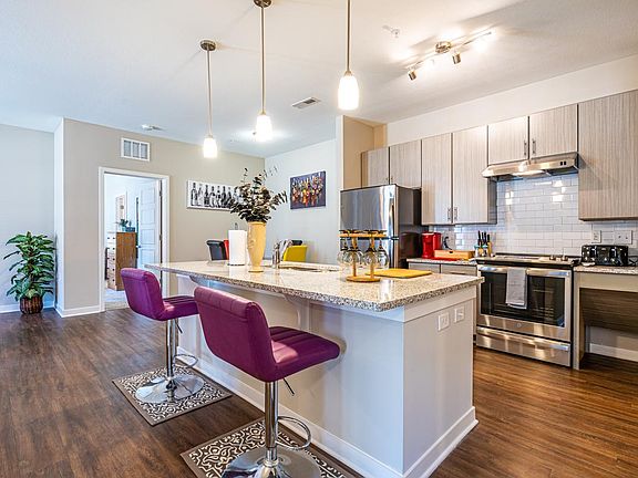 Plenty of space on this kitchen island to pull up a chair and eat while cooking and entertaining. Get comfortable and enjoy!