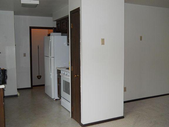 Dining area looking into kitchen and landing area going into