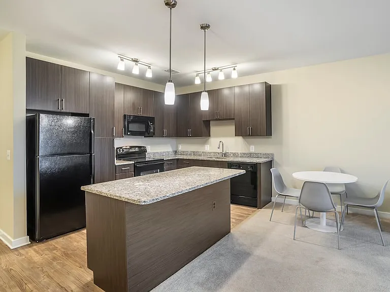 Furnished+ apartment homes include a dining set (Representative Image exact items and style of furnishings may vary)