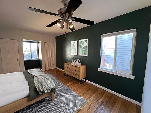 This is the largest bedroom with three closets and plenty of morning light.