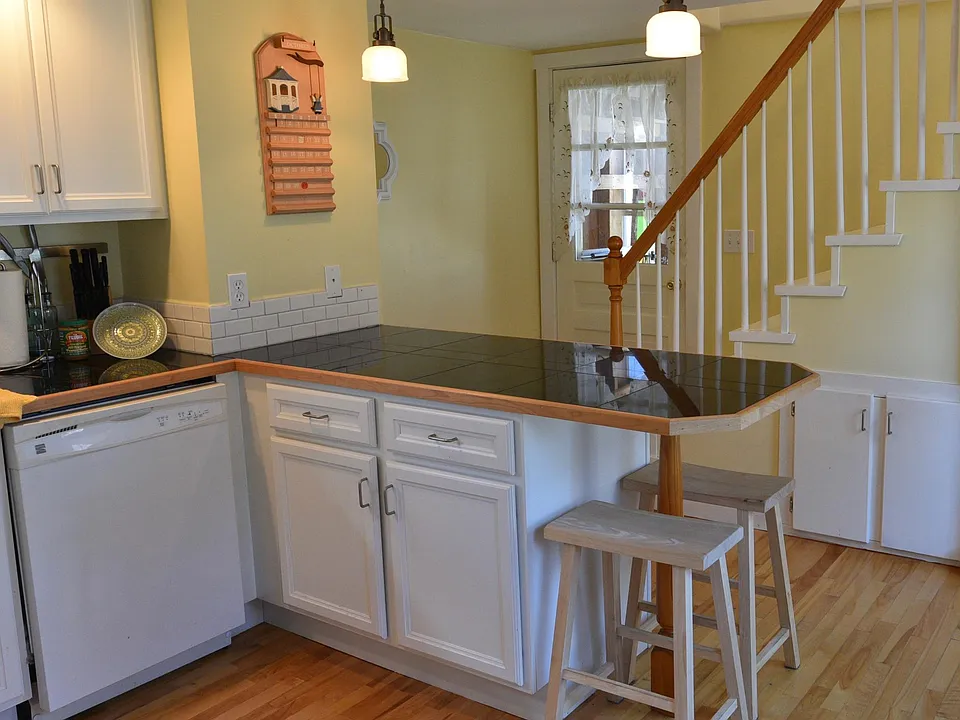 View from kitchen to entry and back stairs