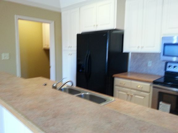 Kitchen looking into Laundry Room