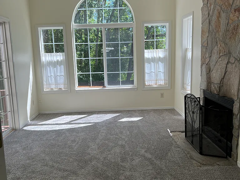 Picture window in Back parlor with fireplace