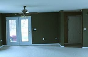 Living room facing entry off driveway