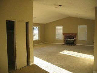 Front room with vaulted ceilings and fireplace