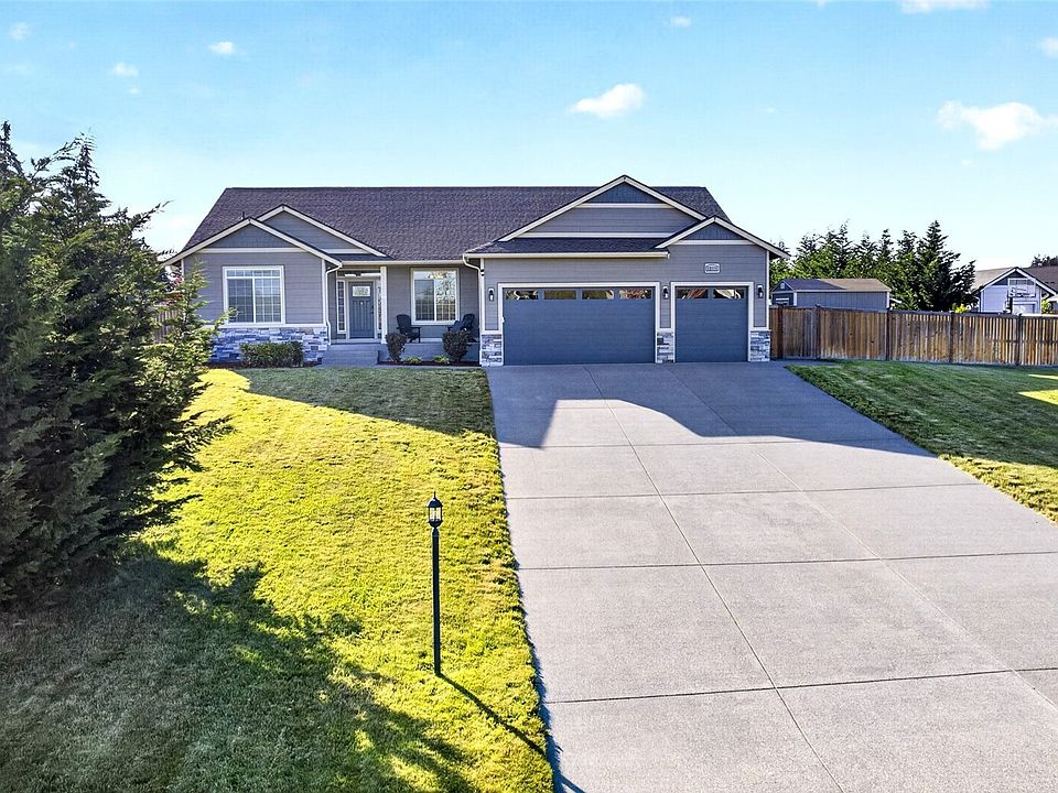 Welcome home to this beautifully maintained rambler featuring attractive stone accents, manicured landscaping, and a three-car garage!>