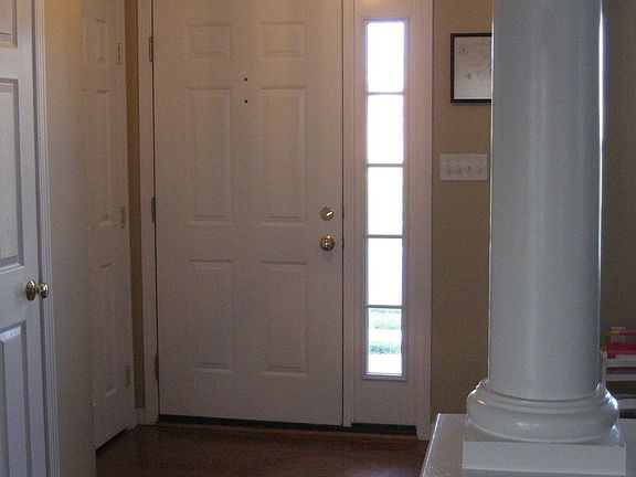 Foyer with half bath and coat closet