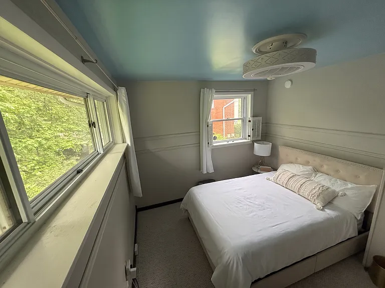 Second bedroom with full-size Eight Sleep smart bed _ full-body temperature control and sleep tracking, with big windows that open wide for natural light and fresh air