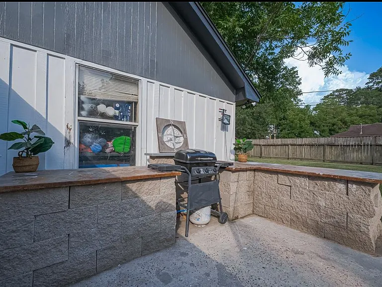 Back yard with view of grill
