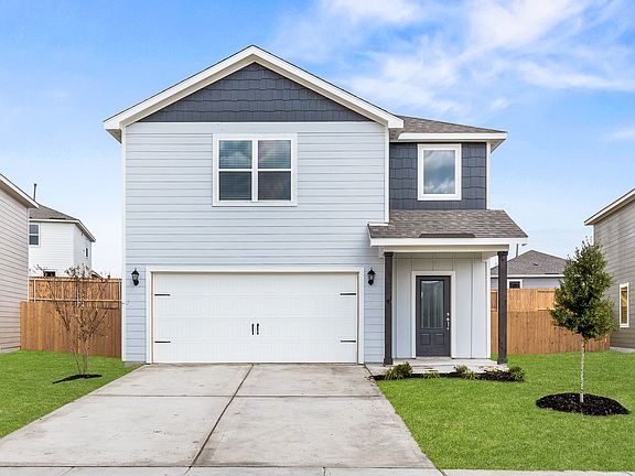 The Rayburn is a beautiful two-story home with an attached two-car garage.