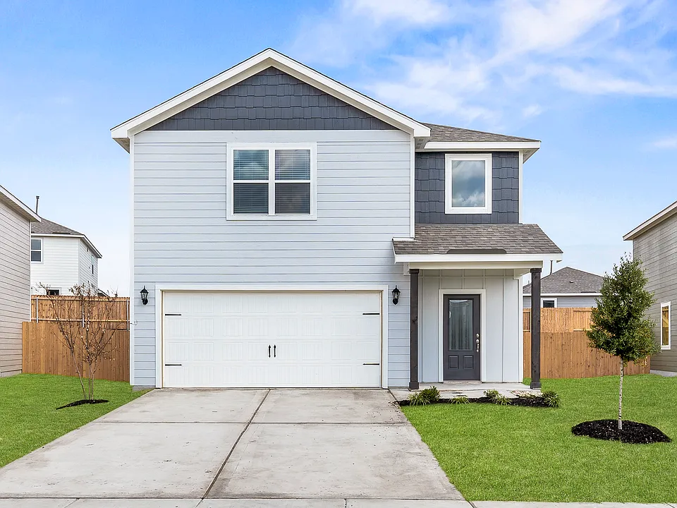 The Rayburn is a beautiful two-story home with an attached two-car garage.