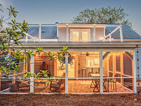 Large screened-in porch. Perfect for entertaining and watching football!
