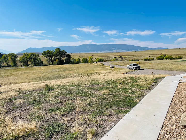 Paved walkways to driveway and garage
