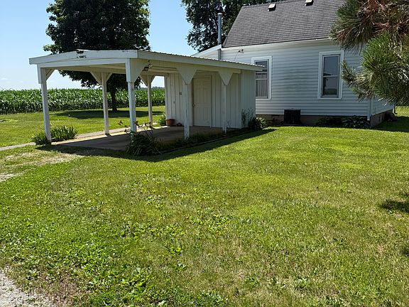 Carport and side view of house