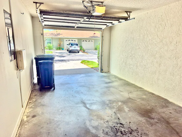 1 Car enclosed garage with a new opener and keypad. 2 additional parking spaces on premise outside garage.