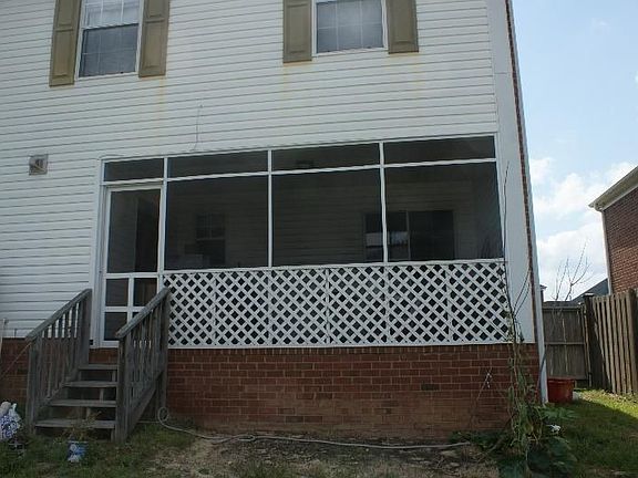 screened back porch and fenced back yard