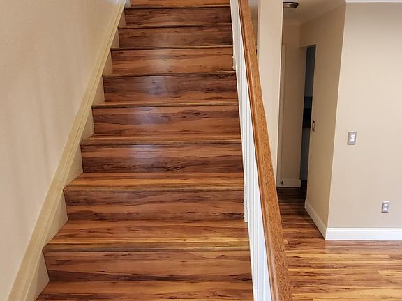 Wood stairs at front entry lead to the 3 bedrooms and 2 full baths are a touch of class, and easy to clean.