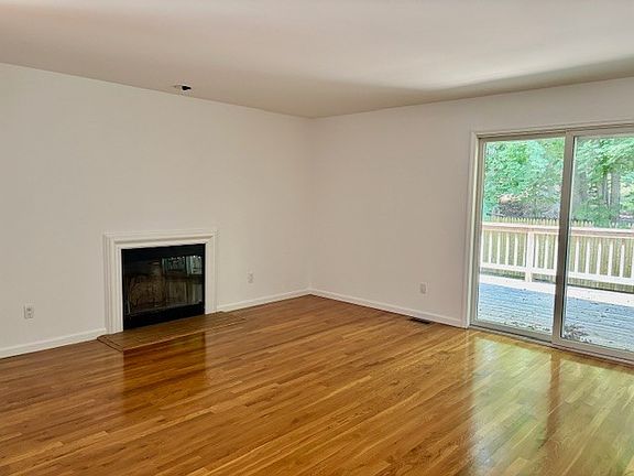 Living Room w/Hardwood Floors & Sliders to Deck