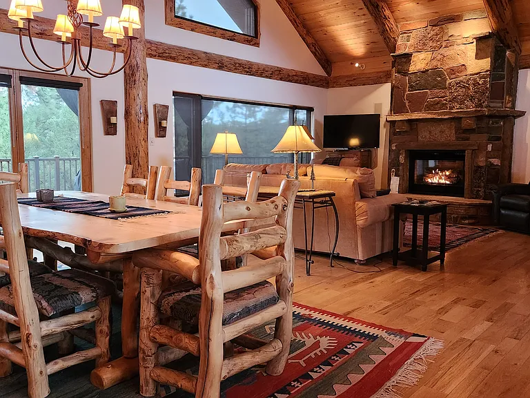 Great room with fireplace and view to deck