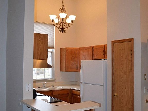 Kitchen has pantry and opens to the eating area. Patio is to the right, and front door is to the left