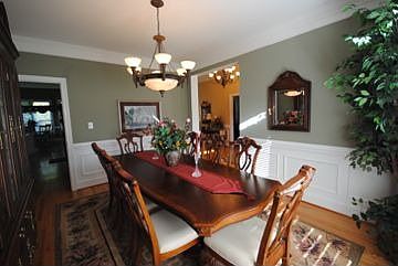 crown molding, chair railing, hardwood floors