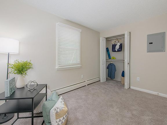 Spacious bedrooms featuring plush carpeting and spacious closets.