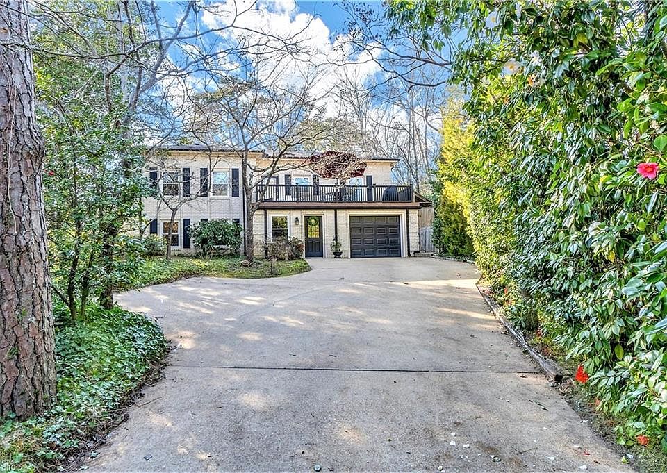STATELY BRICK HOME OFFERS EXTREME PRIVACY IN PRINCESS ANNE HILLS