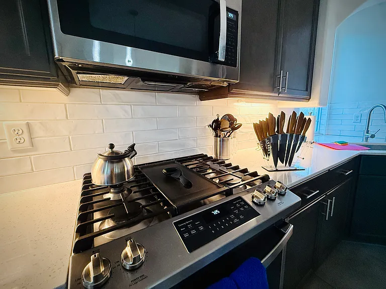 Oversized microwave, oven, and cooktop are a chef's dream. We provide the basic plates, glasses, silverware, and cutlery for your stay.