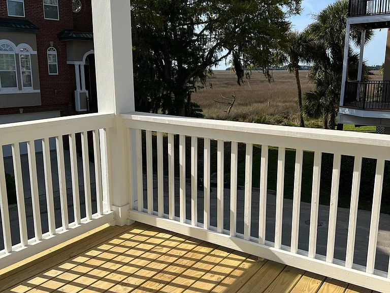 The upstairs deck off the living room, catching the marsh breezes