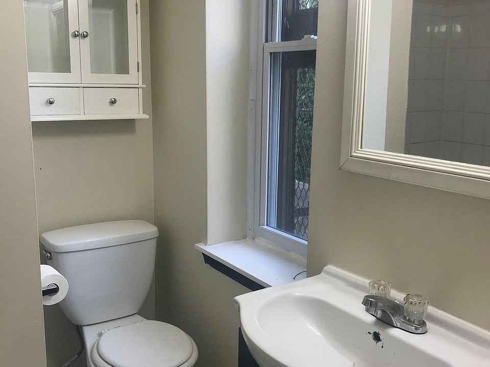 Bathroom sink and toilet, vanity