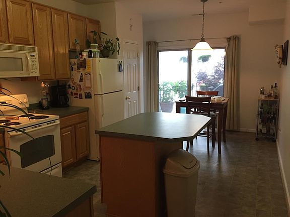 Kitchen island, dining area and balcony