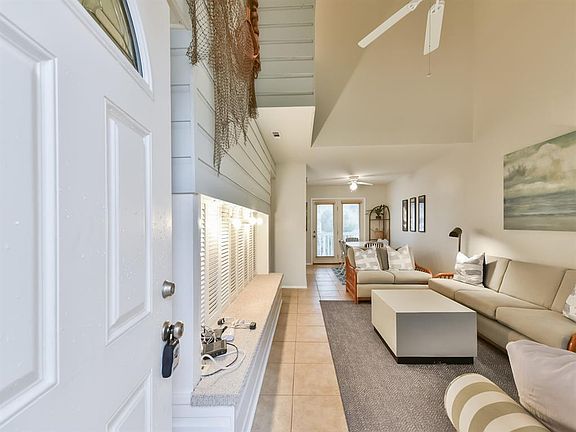 Open the front door to find a spacious bright living room.