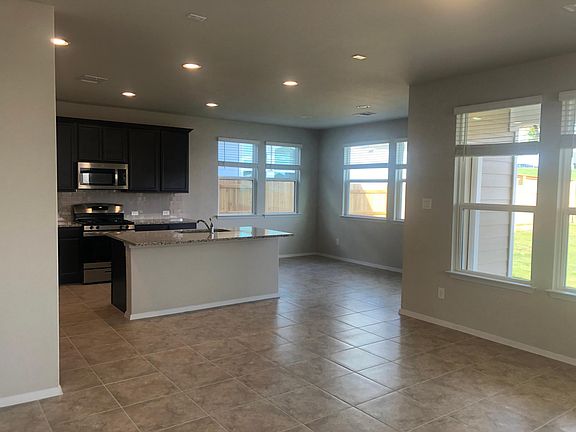 Kitchen and dining area view with plenty of lighting