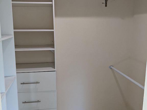 Walk in closet in master bedroom