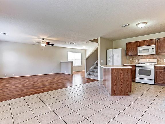 Breakfast nook is open the kitchen and family den and has access to the large backyard.