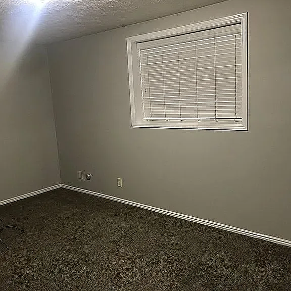 Bedroom #1 with window air conditioner.